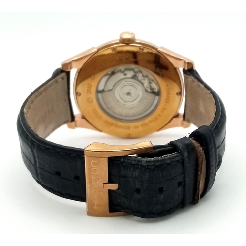 226 - A Men’s Hamilton Gold Tone Automatic, Skeleton Back, Date Watch. Model H386450-42mm Case. Working Or... 