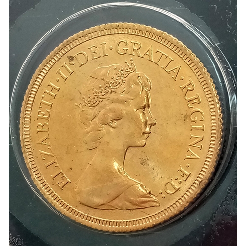 57 - A FULL SOVEREIGN IN 22K GOLD DATED 1979 IN SEALED CONTAINER.