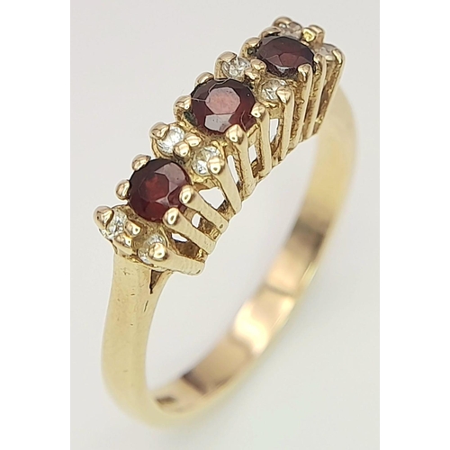 209 - An impressive 9 carat GOLD, TRIPLE GARNET and ZIRCONIA RING. Having gemstones set to top in a beauti... 