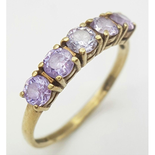 216 - Extremely pretty hallmarked 9 carat GOLD RING, with a Sweep of 5 Pale Amethyst coloured Gemstones se... 