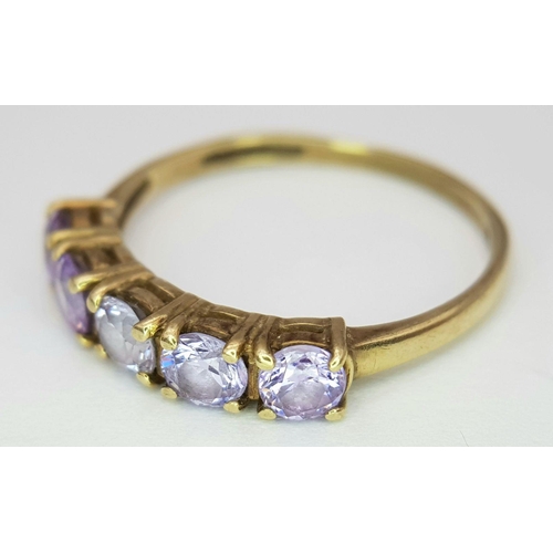 216 - Extremely pretty hallmarked 9 carat GOLD RING, with a Sweep of 5 Pale Amethyst coloured Gemstones se... 