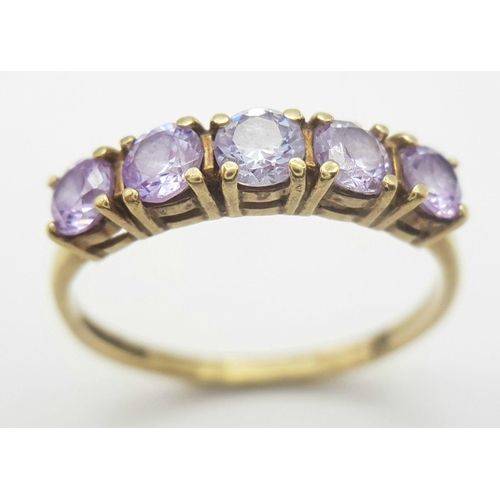 216 - Extremely pretty hallmarked 9 carat GOLD RING, with a Sweep of 5 Pale Amethyst coloured Gemstones se... 