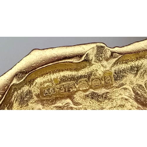 232 - A 9K Yellow Gold Yorkshire Terrier Pendant. 3cm x 2cm. 6g weight.