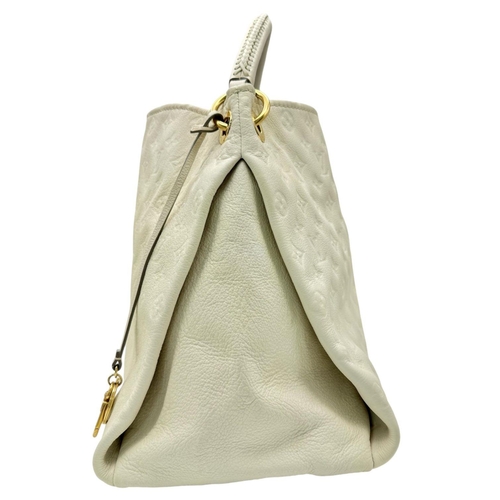 37 - A Louis Vuitton Ivory Empreinte Bag. Monogram leather exterior with gold-toned hardware, single hand... 