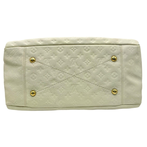 37 - A Louis Vuitton Ivory Empreinte Bag. Monogram leather exterior with gold-toned hardware, single hand... 