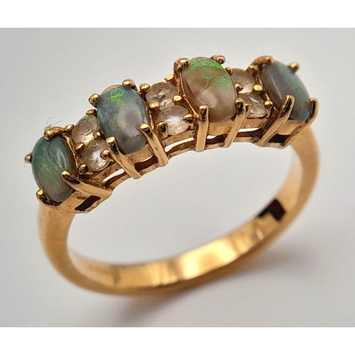 42 - An extremely pretty fully hallmarked 9 carat GOLD, OPAL & TOPAZ RING. Complete with ring box . 2.9 g... 