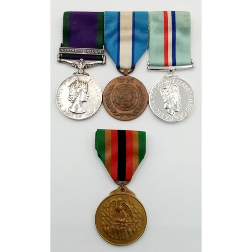 59 - A modern group of four medals including the scarce Rhodesia Medal 1980, consisting of: General Servi... 