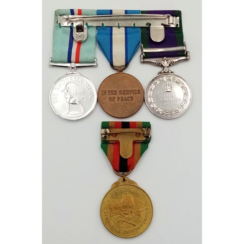 59 - A modern group of four medals including the scarce Rhodesia Medal 1980, consisting of: General Servi... 