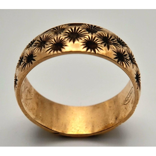 84 - Impressive Hallmarked 9 carat YELLOW GOLD BAND RING covered with chased floral detail. Complete with... 