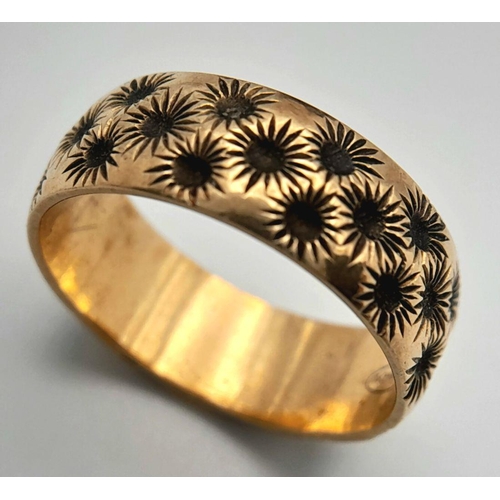 84 - Impressive Hallmarked 9 carat YELLOW GOLD BAND RING covered with chased floral detail. Complete with... 