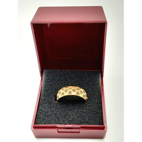 84 - Impressive Hallmarked 9 carat YELLOW GOLD BAND RING covered with chased floral detail. Complete with... 