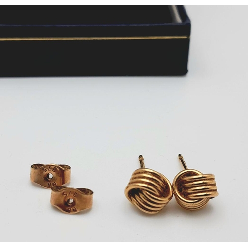 91 - Classic pair of 9 carat GOLD ‘KNOT’ EARRINGS. Complete with Gold Backs. Presented in jewellers earri... 