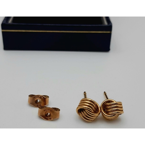 91 - Classic pair of 9 carat GOLD ‘KNOT’ EARRINGS. Complete with Gold Backs. Presented in jewellers earri... 