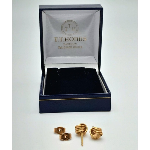 91 - Classic pair of 9 carat GOLD ‘KNOT’ EARRINGS. Complete with Gold Backs. Presented in jewellers earri... 