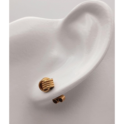 91 - Classic pair of 9 carat GOLD ‘KNOT’ EARRINGS. Complete with Gold Backs. Presented in jewellers earri... 