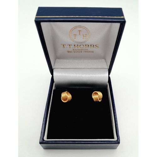 91 - Classic pair of 9 carat GOLD ‘KNOT’ EARRINGS. Complete with Gold Backs. Presented in jewellers earri... 