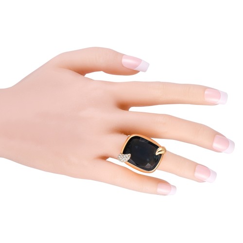 183 - A Pomellato Ritratto 18K Yellow Gold 0.53ct Diamond and London Blue Topaz Ring. An enchanting London... 