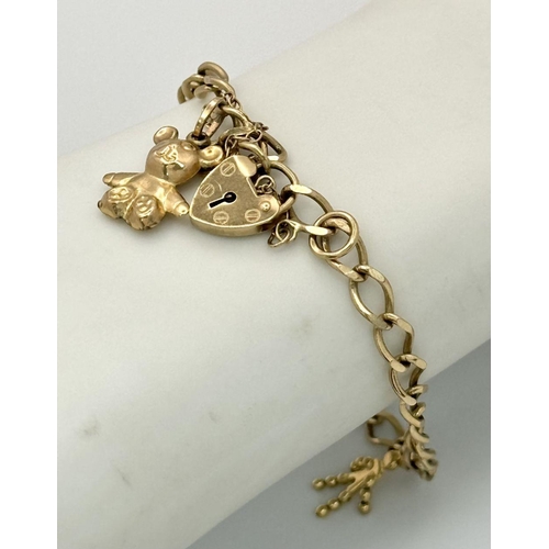 106 - A 9K Gold Charm Bracelet with Heart Clasp. 18cm. 7.1g total weight.