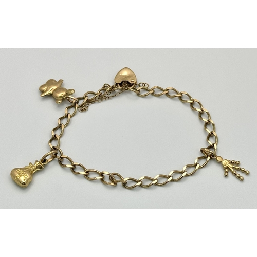 106 - A 9K Gold Charm Bracelet with Heart Clasp. 18cm. 7.1g total weight.