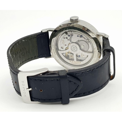 157 - A Nomos Tangomat Automatic Gents Watch. Black leather strap. Stainless steel case - 38mm. Black dial... 