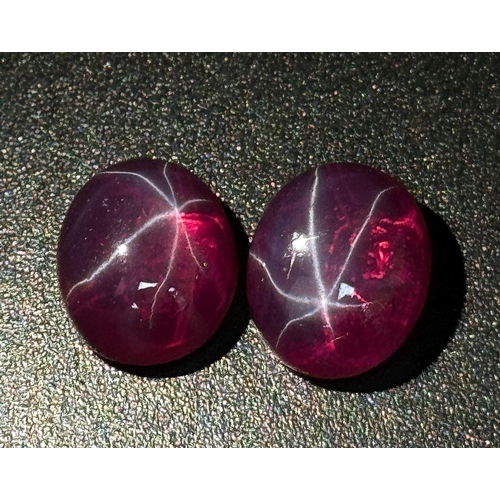 217 - A wonderful pair of SIX RAY STAR RUBY cabochons, 12 x 10 x 5 mm, with strong reaction to UV light an... 