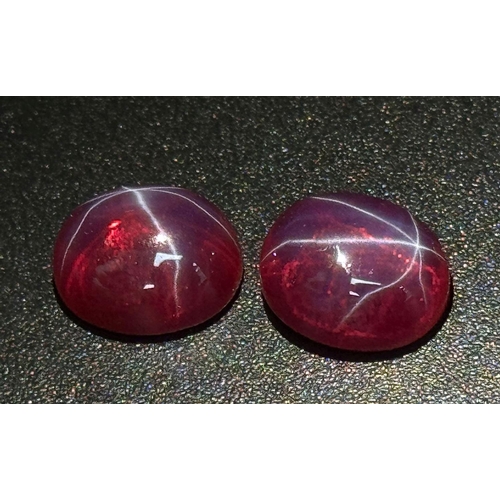 217 - A wonderful pair of SIX RAY STAR RUBY cabochons, 12 x 10 x 5 mm, with strong reaction to UV light an... 