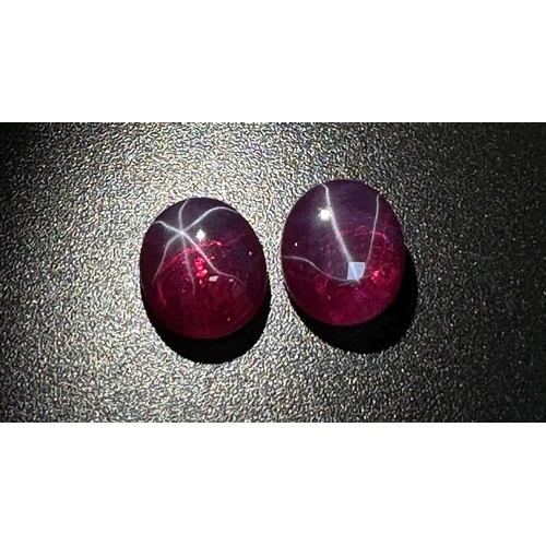 217 - A wonderful pair of SIX RAY STAR RUBY cabochons, 12 x 10 x 5 mm, with strong reaction to UV light an... 