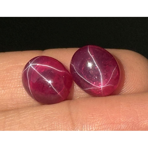 217 - A wonderful pair of SIX RAY STAR RUBY cabochons, 12 x 10 x 5 mm, with strong reaction to UV light an... 