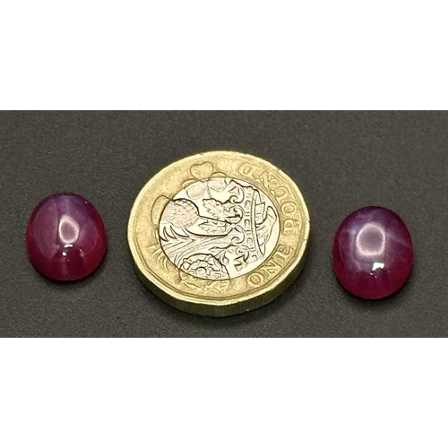 217 - A wonderful pair of SIX RAY STAR RUBY cabochons, 12 x 10 x 5 mm, with strong reaction to UV light an... 