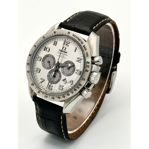 185 - An Omega Speedmaster Broad Arrow Automatic Chronograph Gents Watch. Black leather strap. Stainless s... 