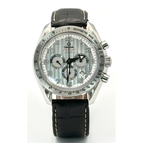 185 - An Omega Speedmaster Broad Arrow Automatic Chronograph Gents Watch. Black leather strap. Stainless s... 