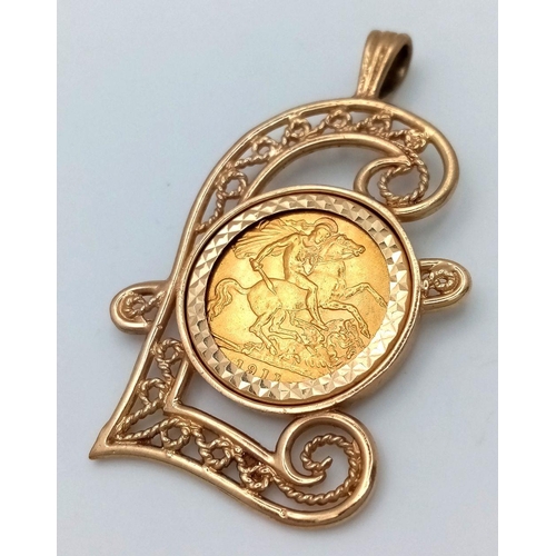 114 - A 1911 HALF SOVEREIGN COIN SET IN A 9K GOLD POUND SIGN PENDANT .     10gms    5.5cms drop