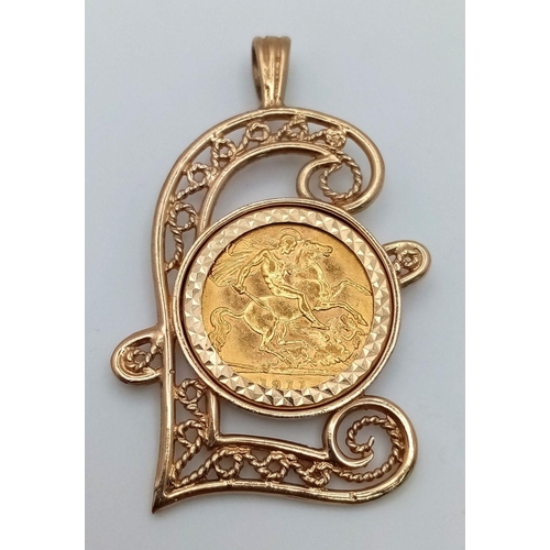 114 - A 1911 HALF SOVEREIGN COIN SET IN A 9K GOLD POUND SIGN PENDANT .     10gms    5.5cms drop