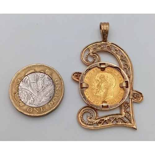 114 - A 1911 HALF SOVEREIGN COIN SET IN A 9K GOLD POUND SIGN PENDANT .     10gms    5.5cms drop