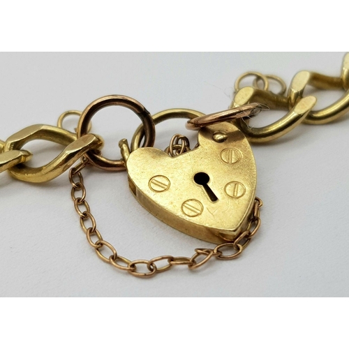 93 - A 9K Yellow Gold Curb Bracelet with Heart Clasp. 16cm. 11.15g weight.