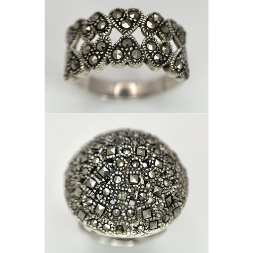 1681 - Two 925 Silver Decorative Marcasite Rings. Bulbous pave and hearts of plenty. Both size O.