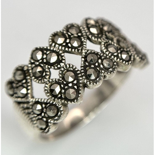 1681 - Two 925 Silver Decorative Marcasite Rings. Bulbous pave and hearts of plenty. Both size O.