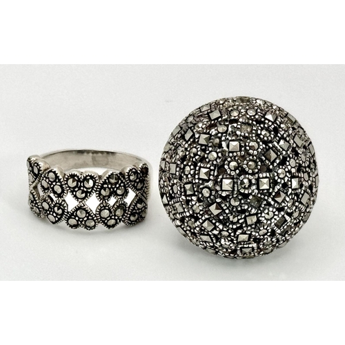 1681 - Two 925 Silver Decorative Marcasite Rings. Bulbous pave and hearts of plenty. Both size O.