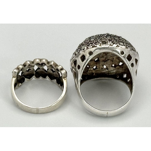 1681 - Two 925 Silver Decorative Marcasite Rings. Bulbous pave and hearts of plenty. Both size O.