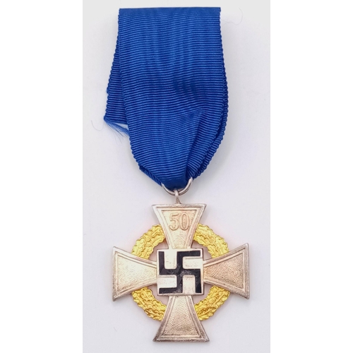 187 - 3rd Reich 50 year Faithful Service Medal. The enamel to the central swastika undamaged. Slight tonin... 