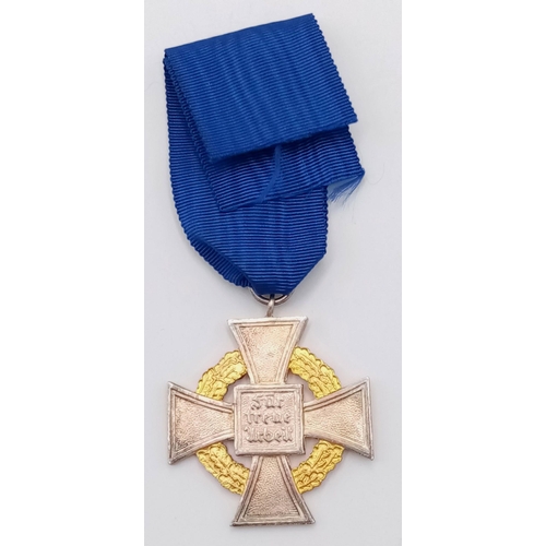 187 - 3rd Reich 50 year Faithful Service Medal. The enamel to the central swastika undamaged. Slight tonin... 