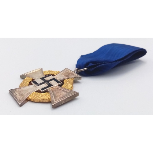 187 - 3rd Reich 50 year Faithful Service Medal. The enamel to the central swastika undamaged. Slight tonin... 