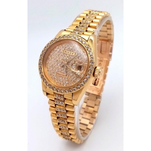 302 - A stunning 18 K yellow gold, ladies ROLEX watch with pave diamonds on bezel, dial and bracelet, case... 