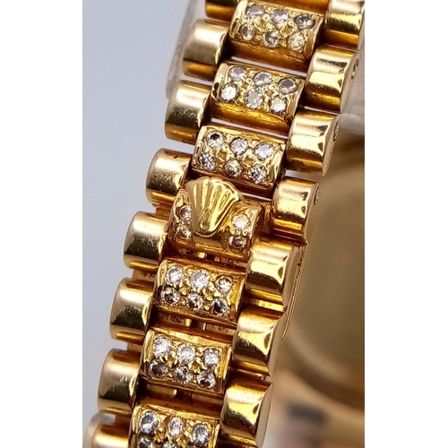 302 - A stunning 18 K yellow gold, ladies ROLEX watch with pave diamonds on bezel, dial and bracelet, case... 