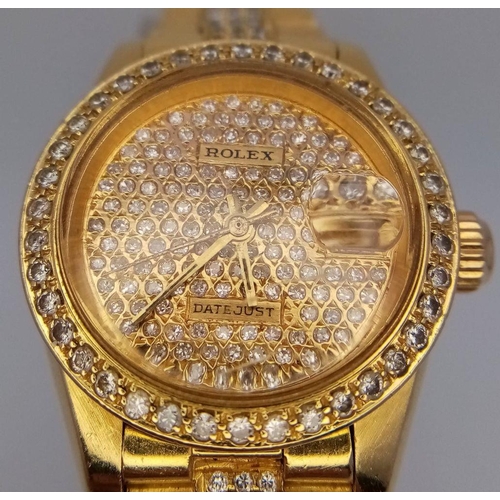 302 - A stunning 18 K yellow gold, ladies ROLEX watch with pave diamonds on bezel, dial and bracelet, case... 