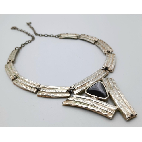 105 - A vintage DOLCE VITA (signed), hand made necklace with a beautiful cat’s eye central stone. Length: ... 