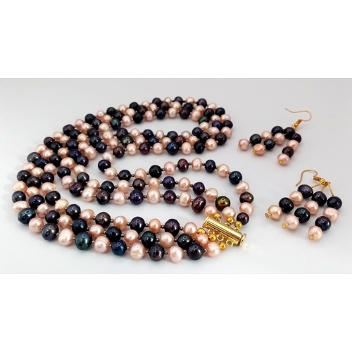 119 - A three-row necklace with black and pink cultured pearls accompanied by matching earrings. Necklace ... 