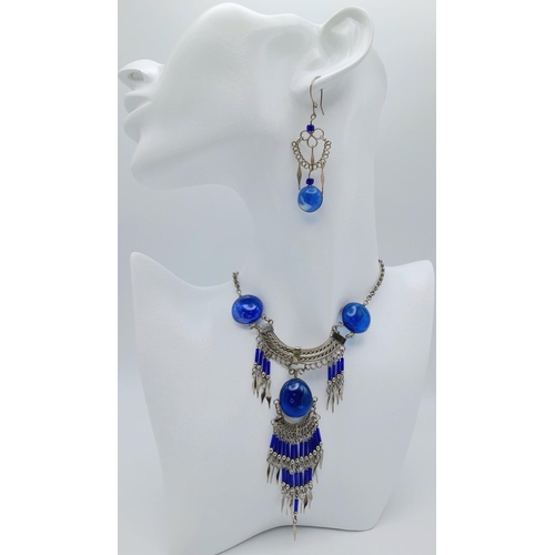 126 - A white metal (untested) necklace and earrings set in the style of Native American tradition, in a p... 