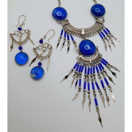 126 - A white metal (untested) necklace and earrings set in the style of Native American tradition, in a p... 