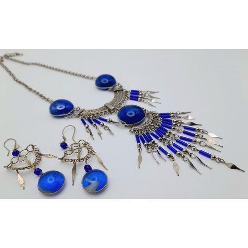 126 - A white metal (untested) necklace and earrings set in the style of Native American tradition, in a p... 